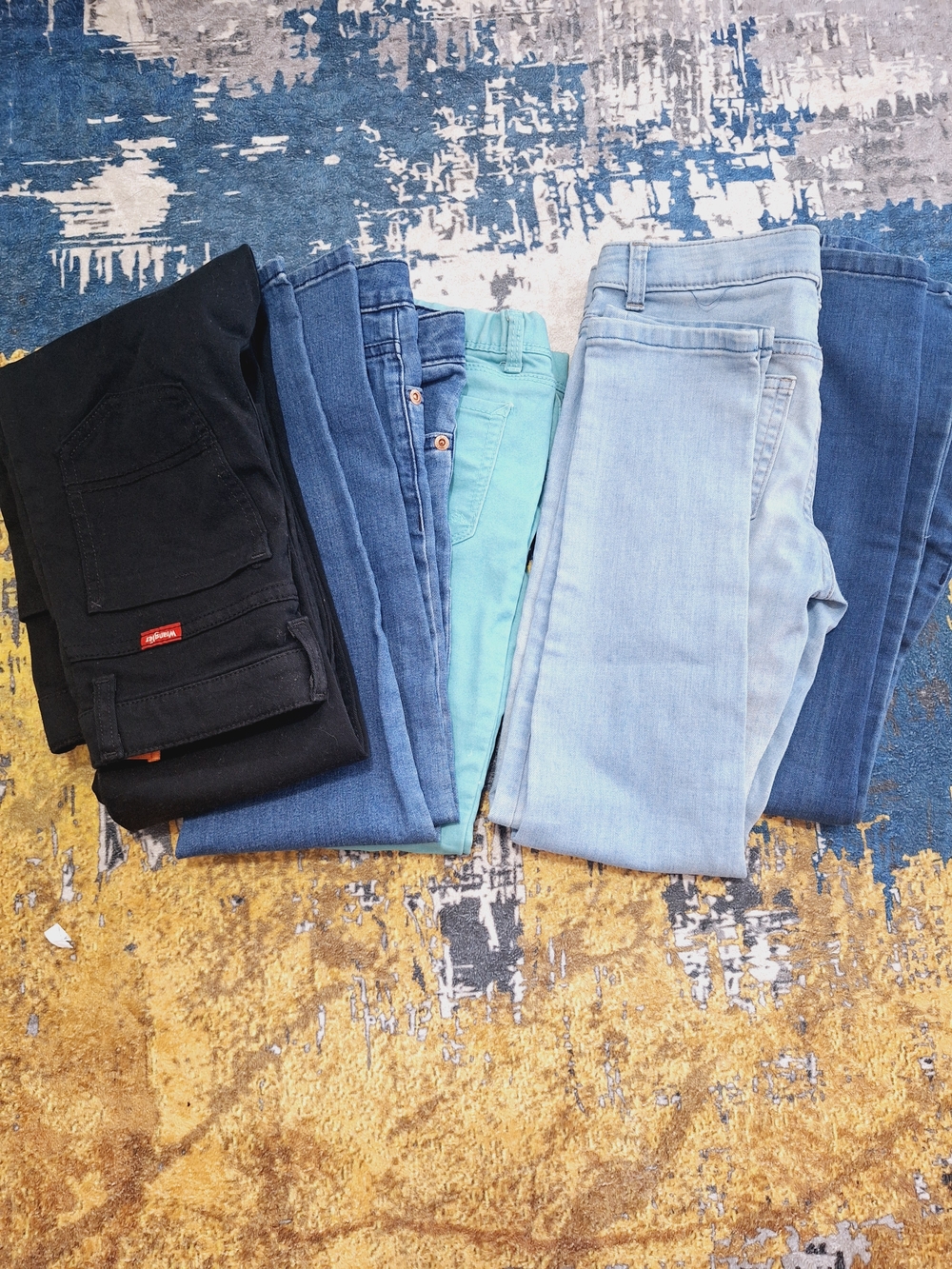 “5 jeans for sale: 3 size 8, 2 size 12.